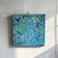 Kleurrijk fluid art schilderij in acryl op doek van Arendina Borreman, 20x20 cm, met vloeiende organische vormen en rijke kleuren.