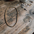 Goudkleurige rope chain ketting met fijn gedraaid gevlochten schakelpatroon, totale lengte 62cm
