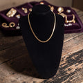 Goudkleurige schakelketting met platte fijne schakelstructuur, totale lengte 50cm
