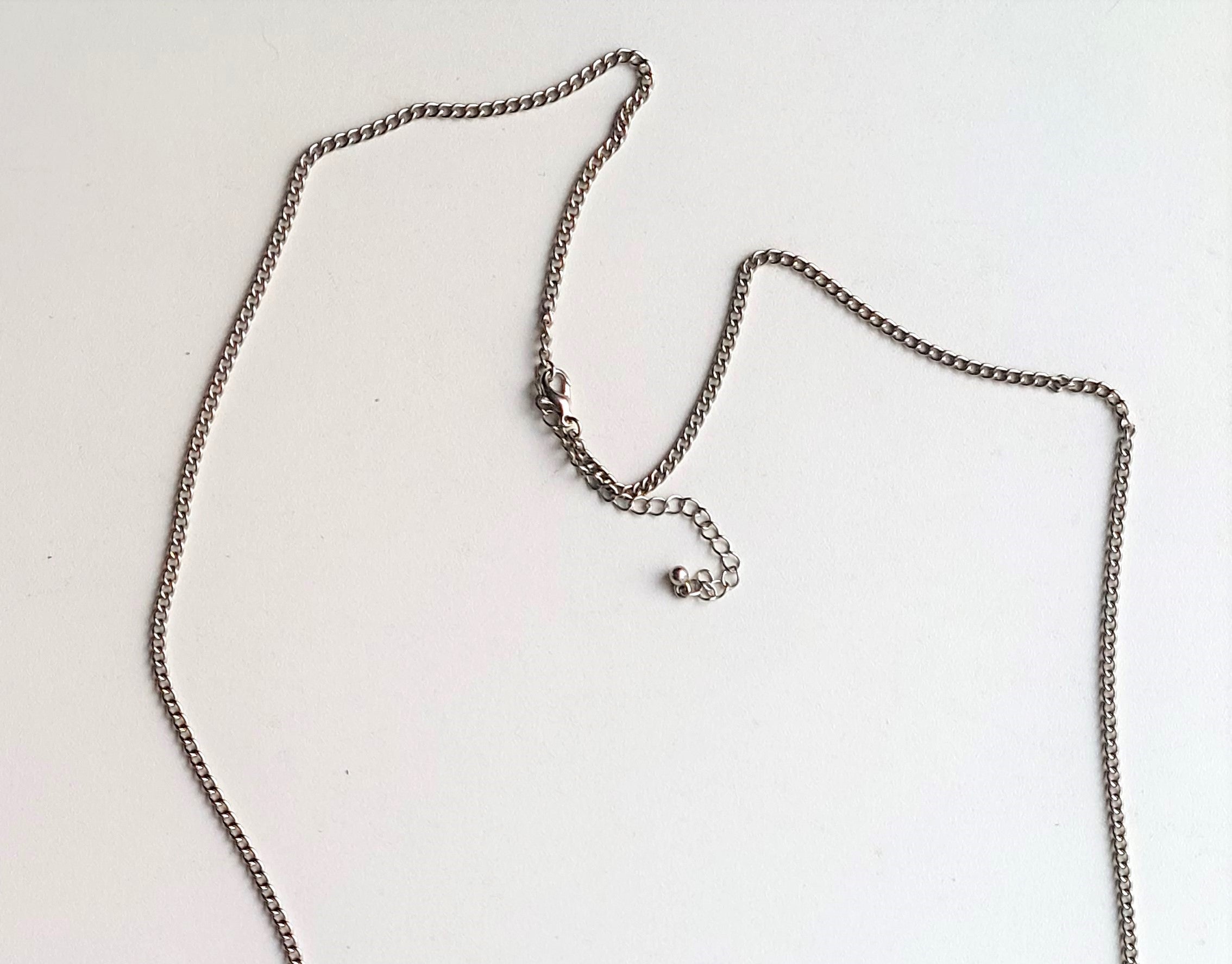 silver-colored necklace beads and butterflies