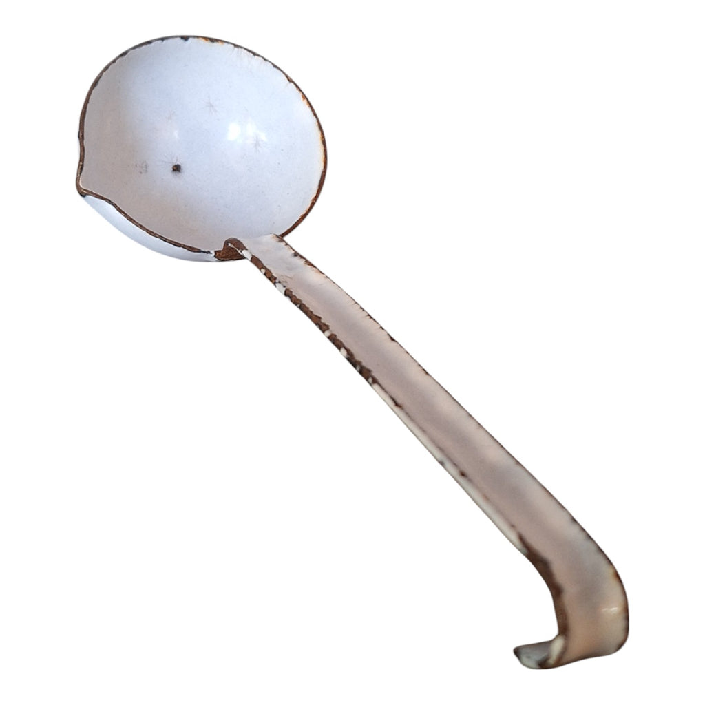 Vintage white with a bluish sheen enameled gravy spoon