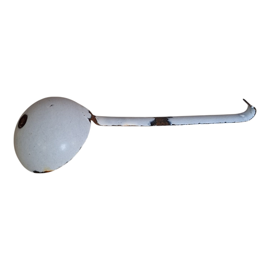 Vintage white with a bluish sheen enameled gravy spoon