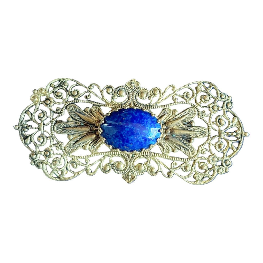 Filigrane Brosche mit blauem Stein – Reich verzierter Modeschmuck