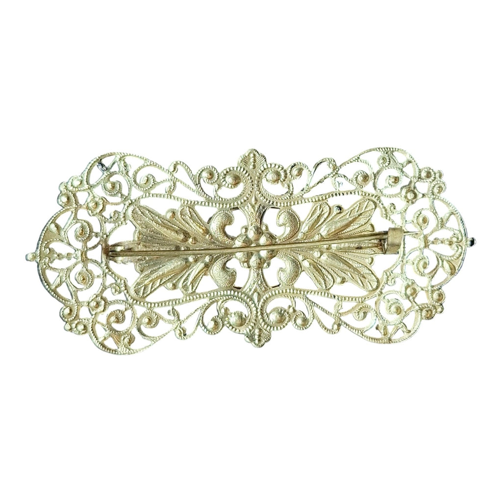 Filigrane Brosche mit blauem Stein – Reich verzierter Modeschmuck