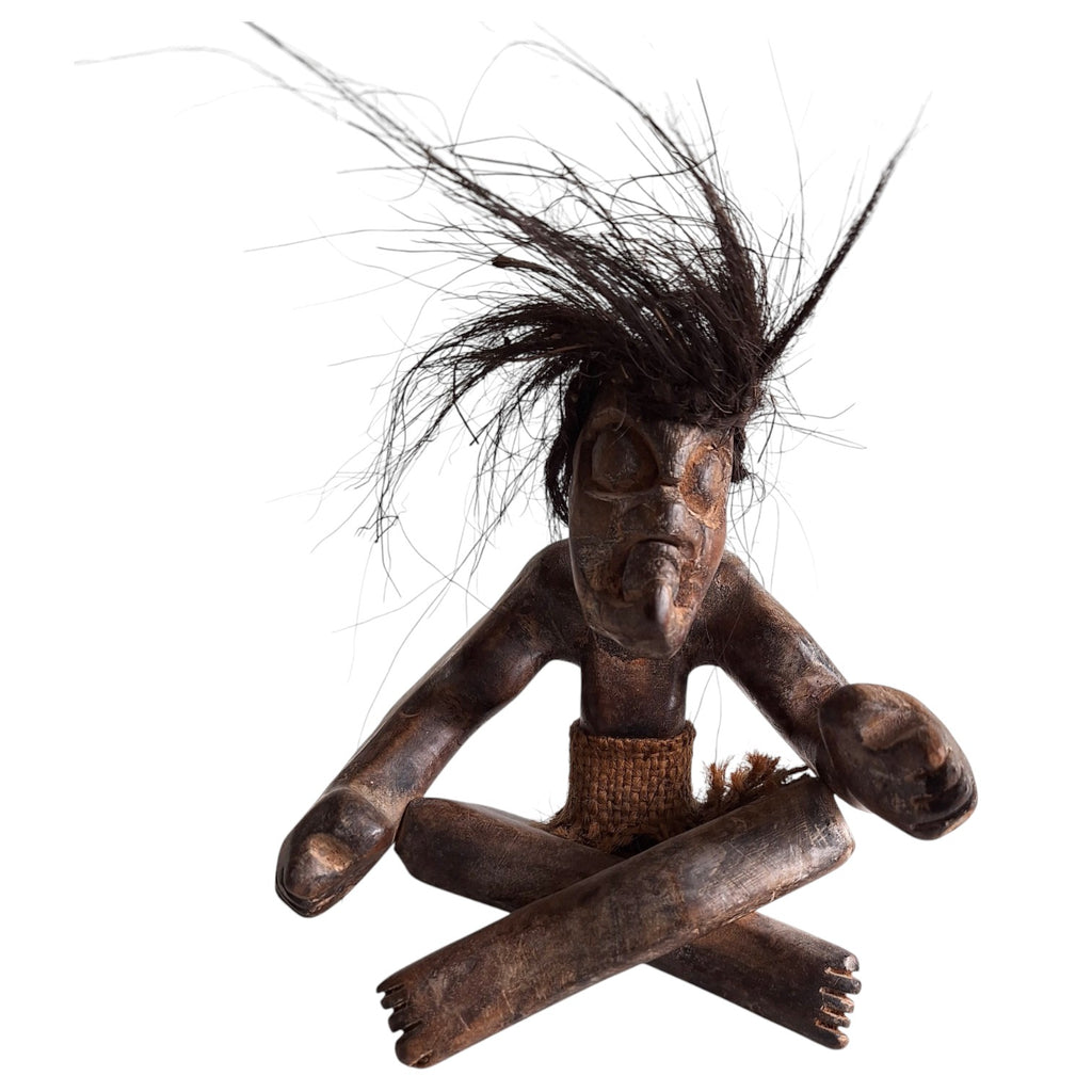 Hand-carved wooden tribal style Tiki sculpture – seated figure