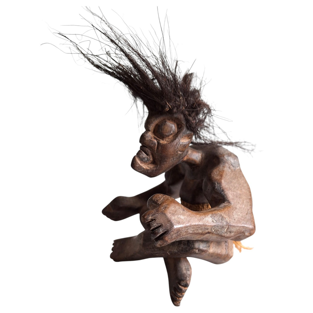 Hand-carved wooden tribal style Tiki sculpture – seated figure