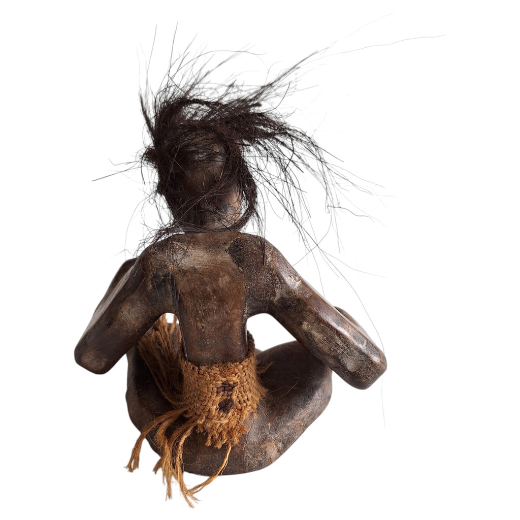 Hand-carved wooden tribal style Tiki sculpture – seated figure