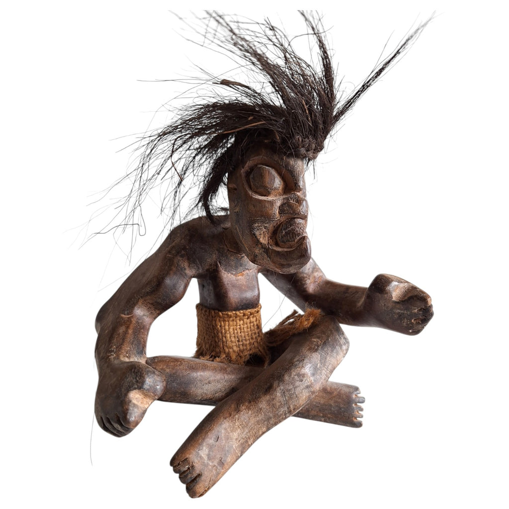 Hand-carved wooden tribal style Tiki sculpture – seated figure