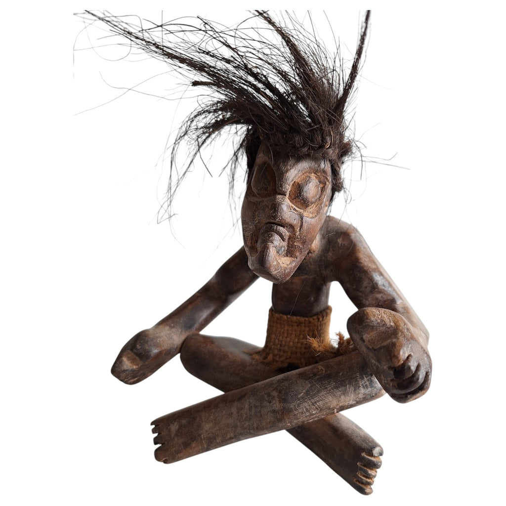 Hand-carved wooden tribal style Tiki sculpture – seated figure