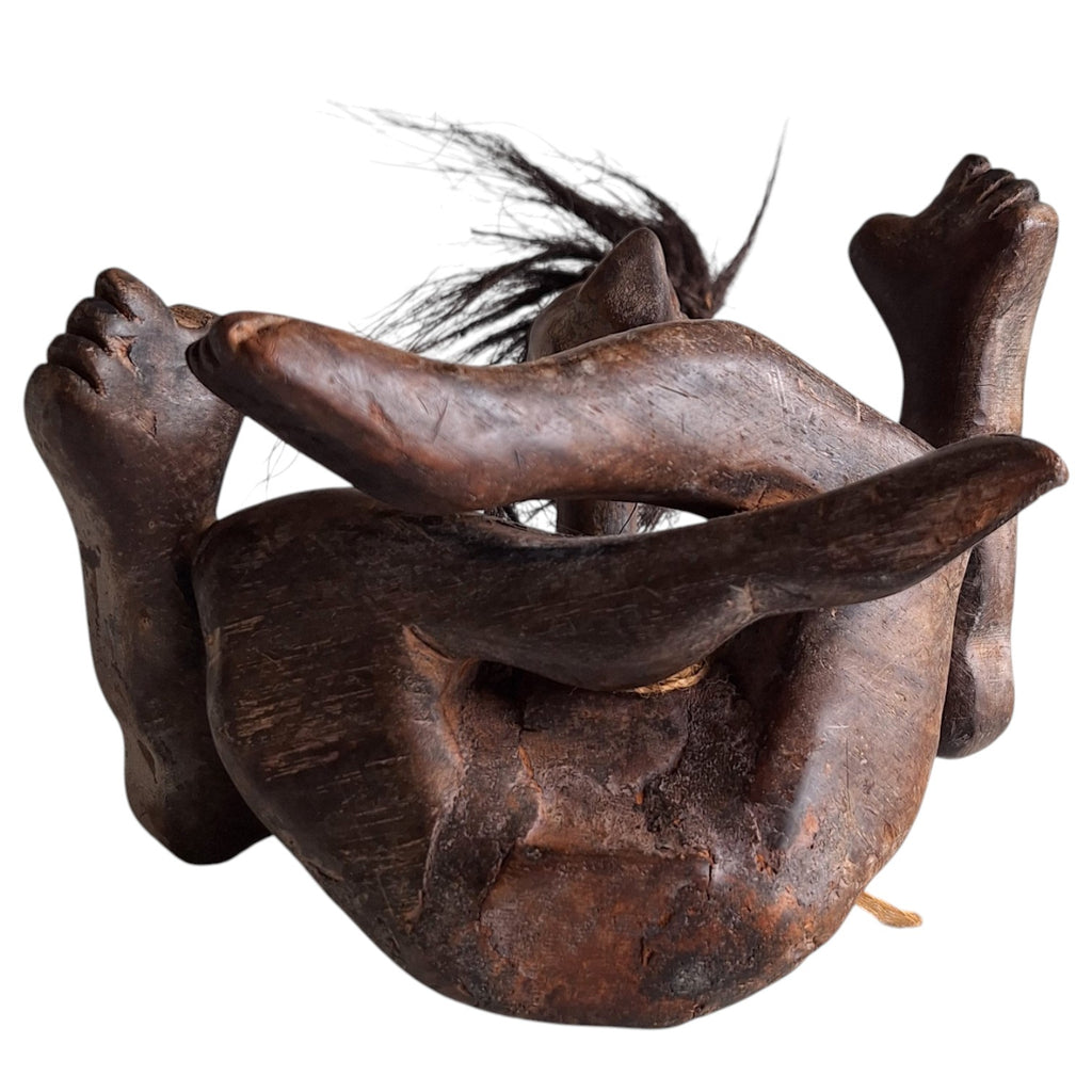 Hand-carved wooden tribal style Tiki sculpture – seated figure