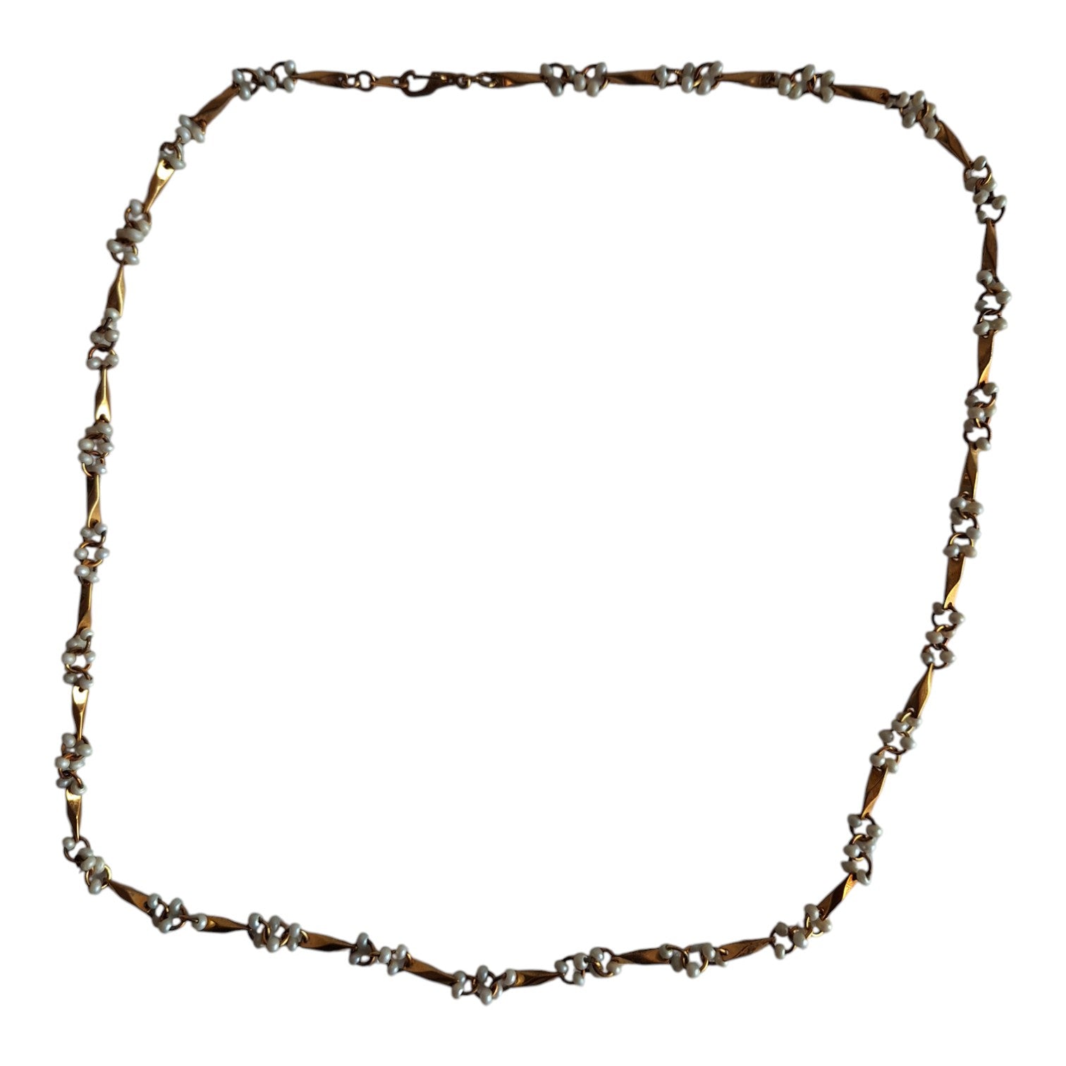 Gold-colored necklace with white beads