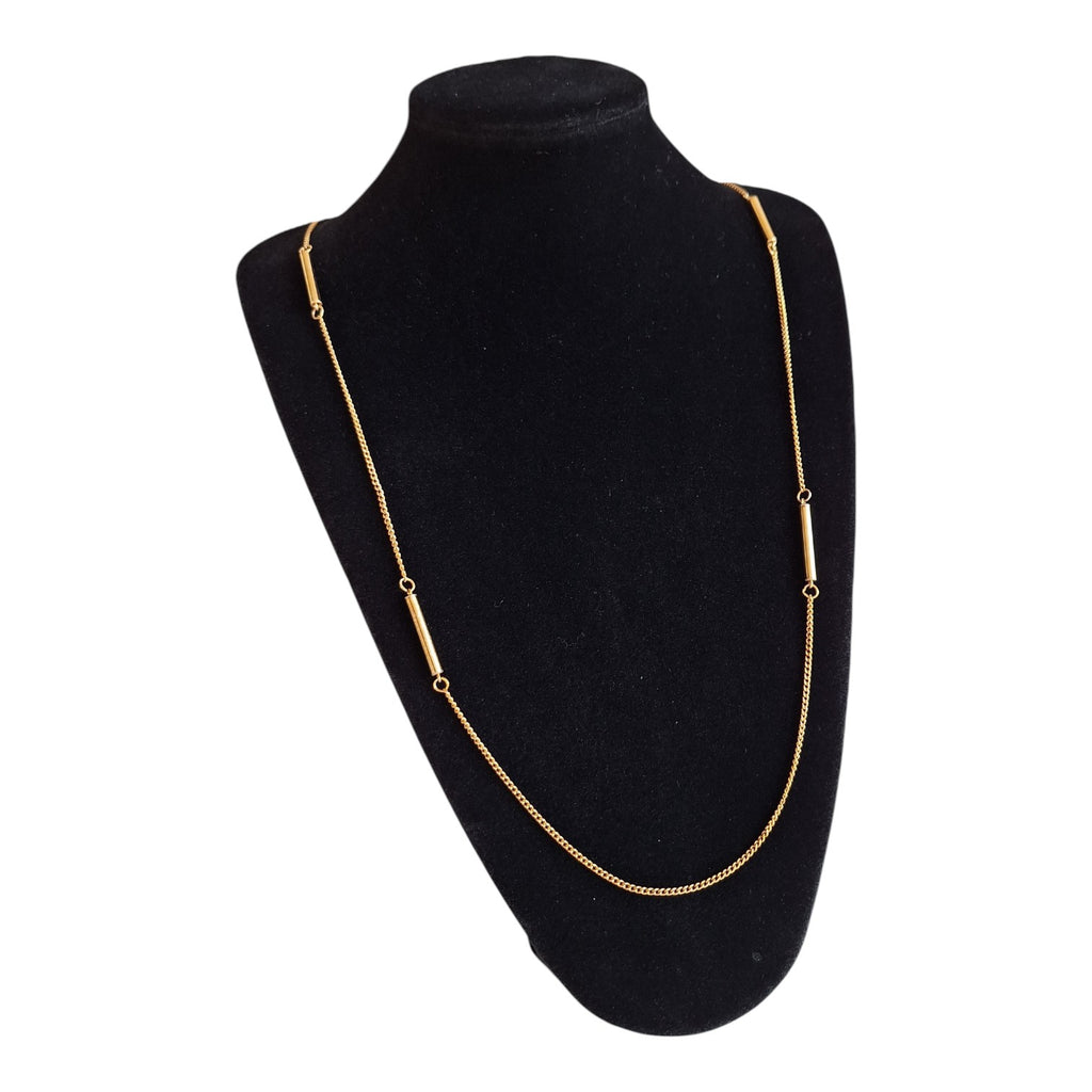 Gold-colored long simple necklace