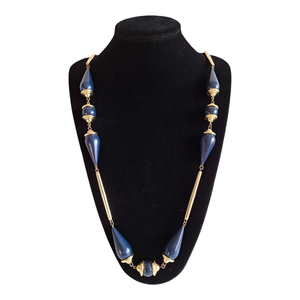 Gold-colored necklace with various blue wooden beads