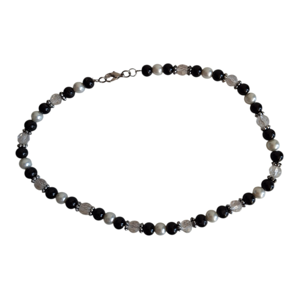 Necklace with black, white, and transparent beads