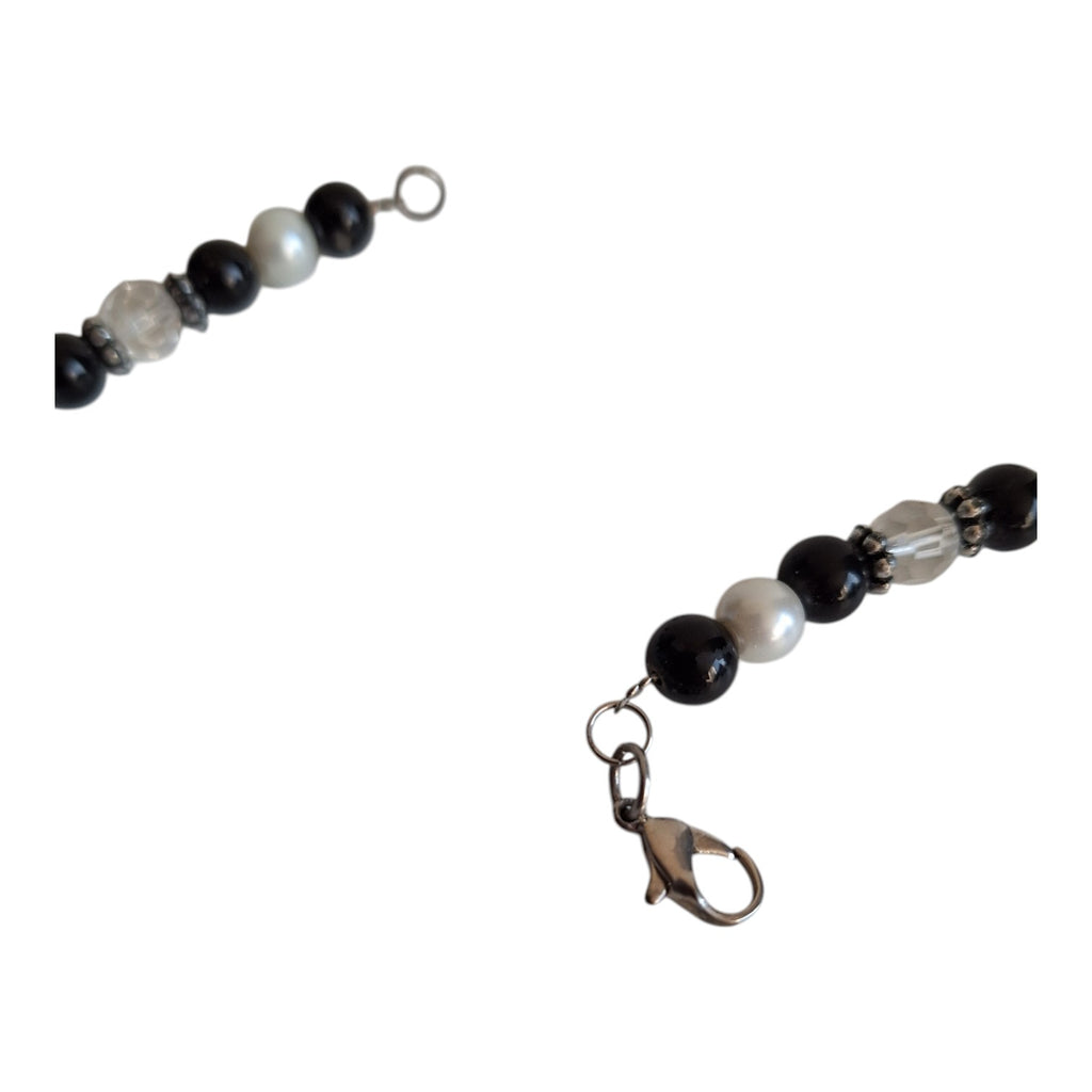 Necklace with black, white, and transparent beads