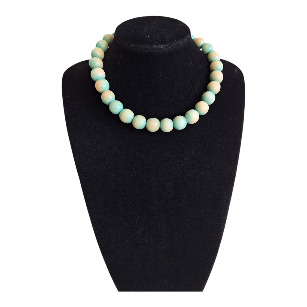Wooden bead necklace with green tint