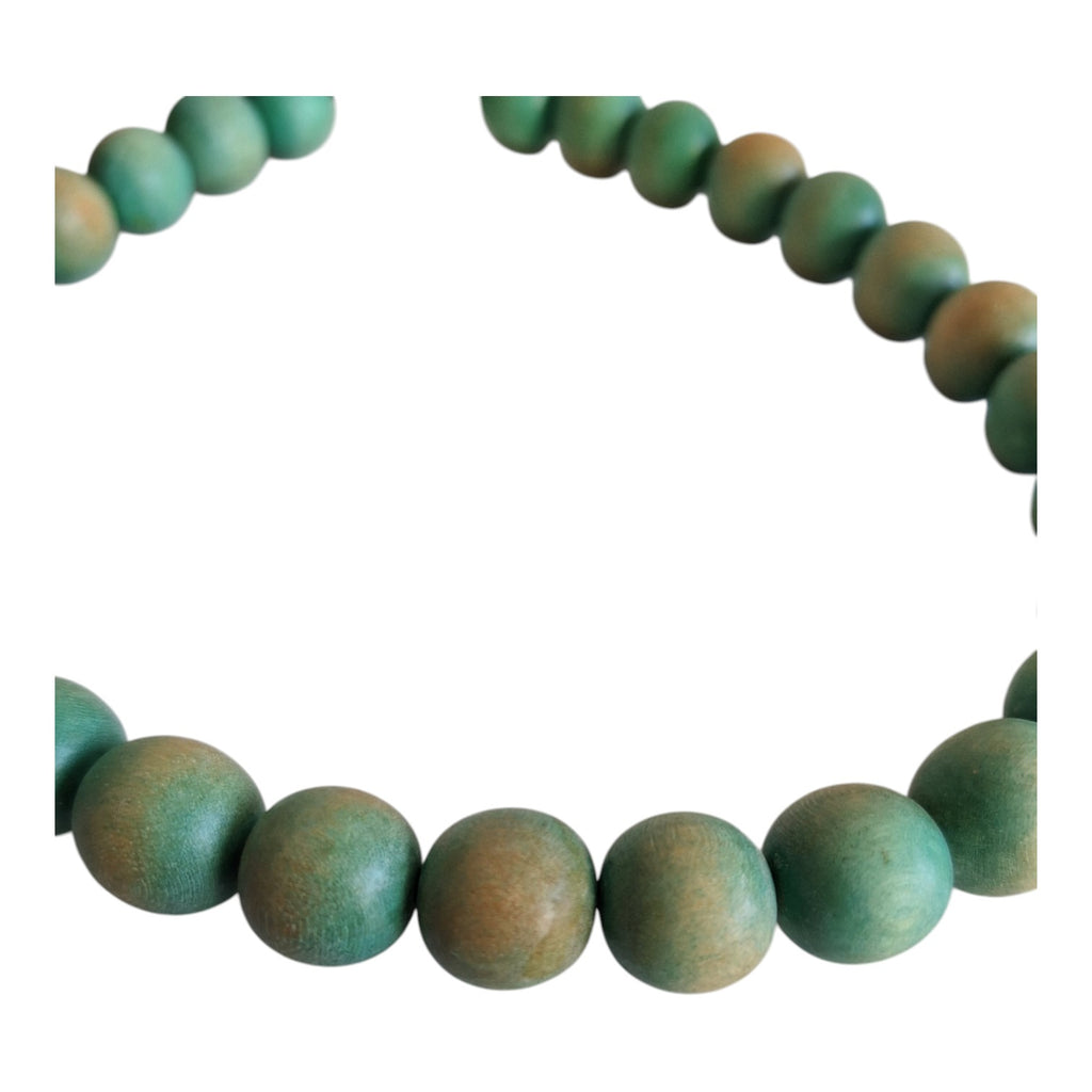 Wooden bead necklace with green tint