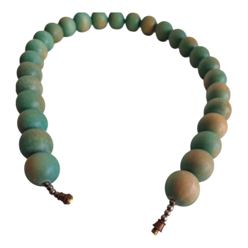 Wooden bead necklace with green tint