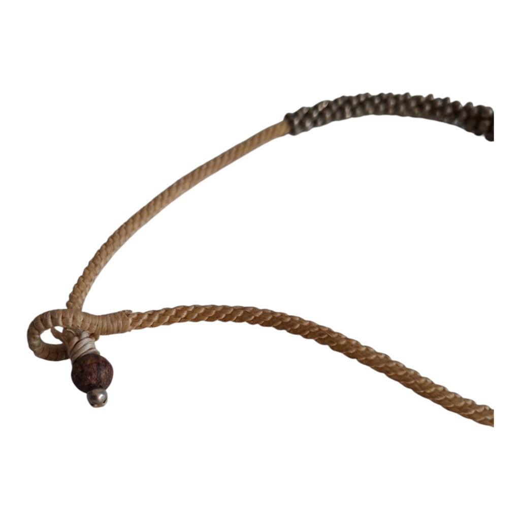 Silver-colored beads strung on a cord