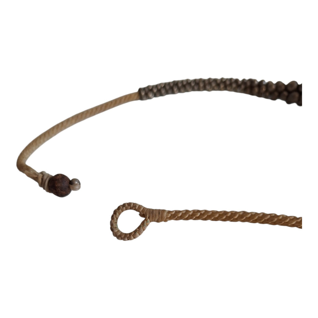 Silver-colored beads strung on a cord