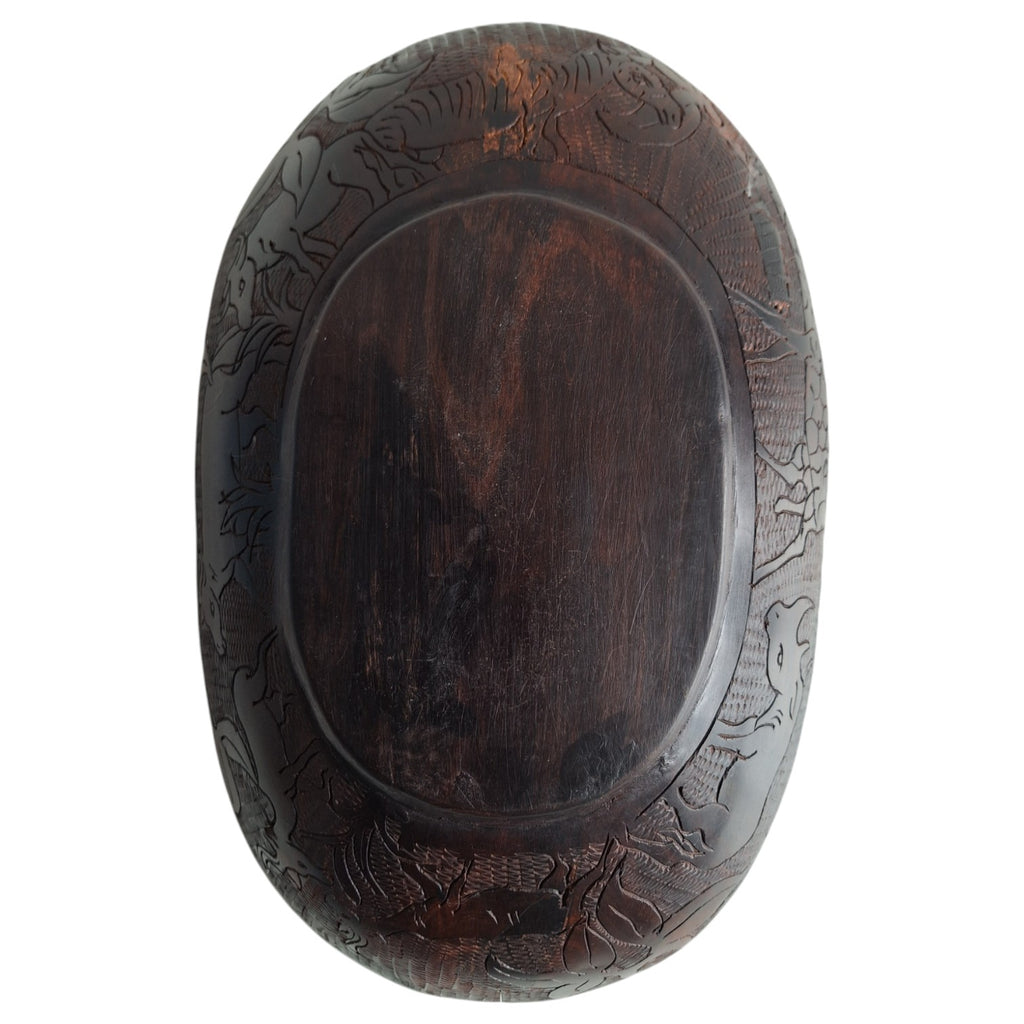 Hand-carved wooden bowl with animal motifs – African craftsmanship