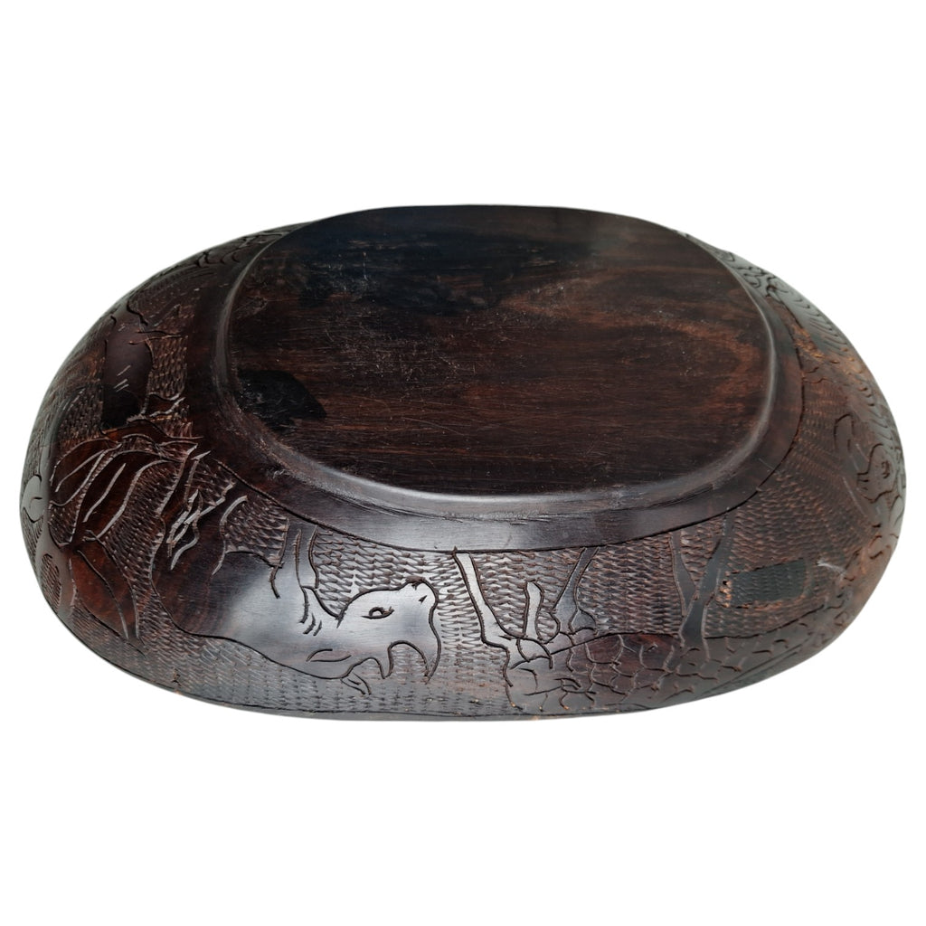Hand-carved wooden bowl with animal motifs – African craftsmanship