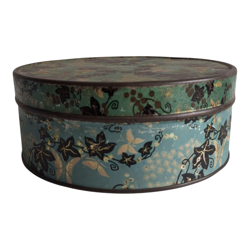 Runde blaue Dose mit Blattmotiv — Dekorative Retro-Vorratsdose