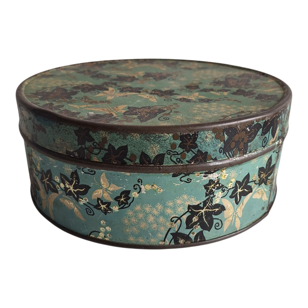 Runde blaue Dose mit Blattmotiv — Dekorative Retro-Vorratsdose