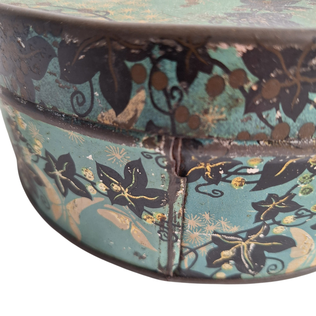 Runde blaue Dose mit Blattmotiv — Dekorative Retro-Vorratsdose