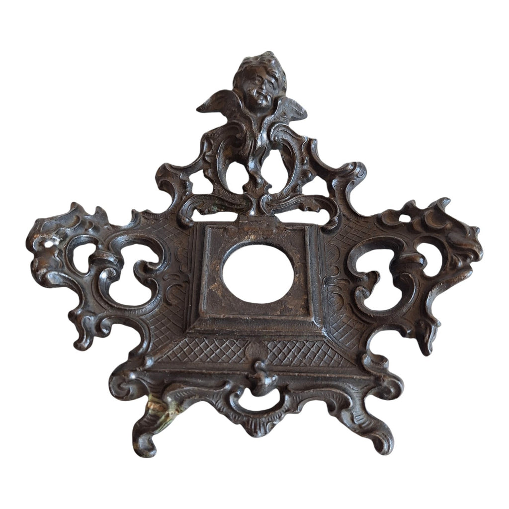 2nd Hand Bargain antique ornate cherub metal clock frame with dark aged finish and scrollwork.