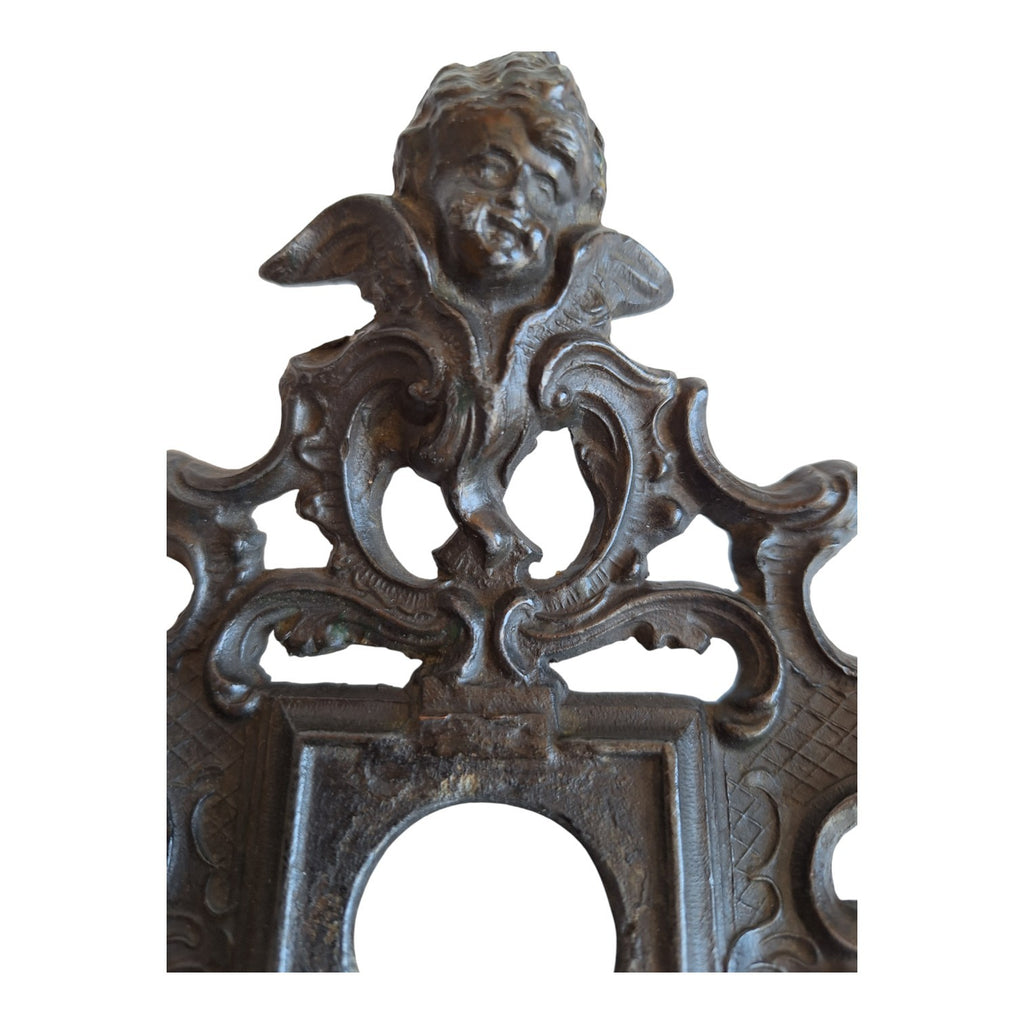 2nd Hand Bargain antique ornate metal clock frame with cherub and scrollwork, dark aged finish.