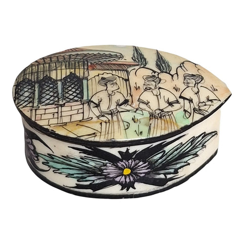 2nd Hand Bargain hand-painted bone pill box with figures and building scene, floral detail. 2.5cm H x 5.5cm D.