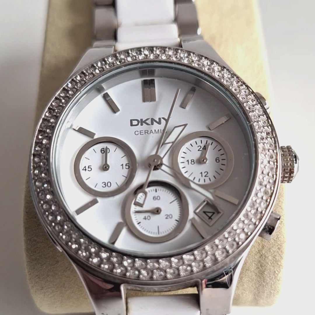 DKNY NY8181 dameshorloge - wit keramiek met strass-bezel en stalen band, 39mm